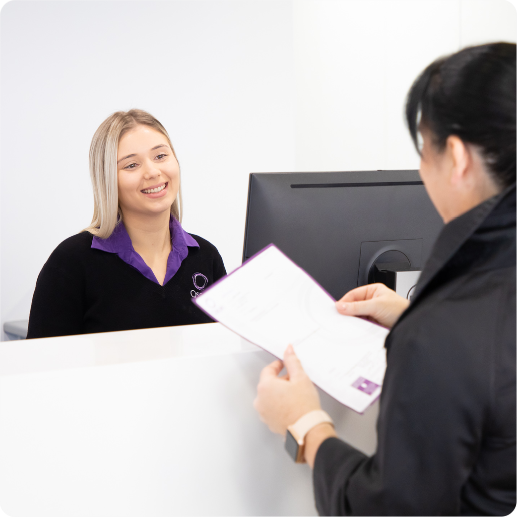 Lady handing over referral