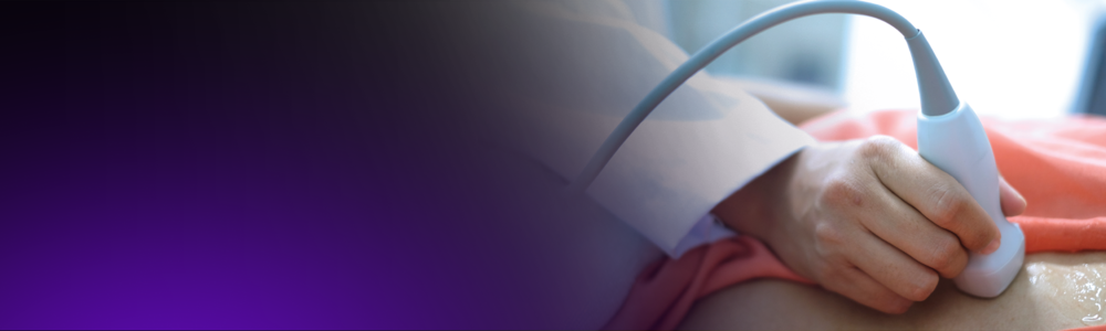 A close up of a sonographer performing an ultrasound