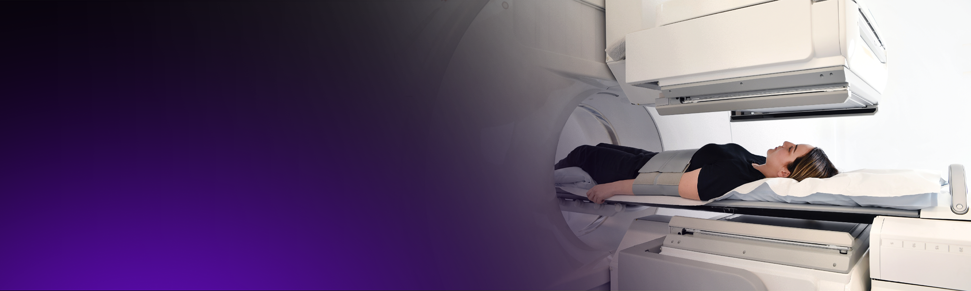 A female patient has a nuclear medicine scan.
