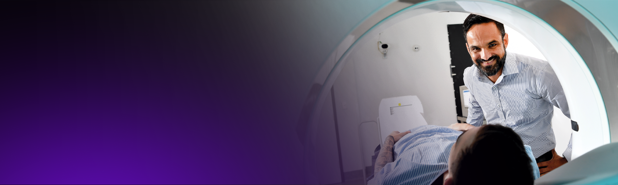 A radiologist positions a patient for a PET-CT scan.