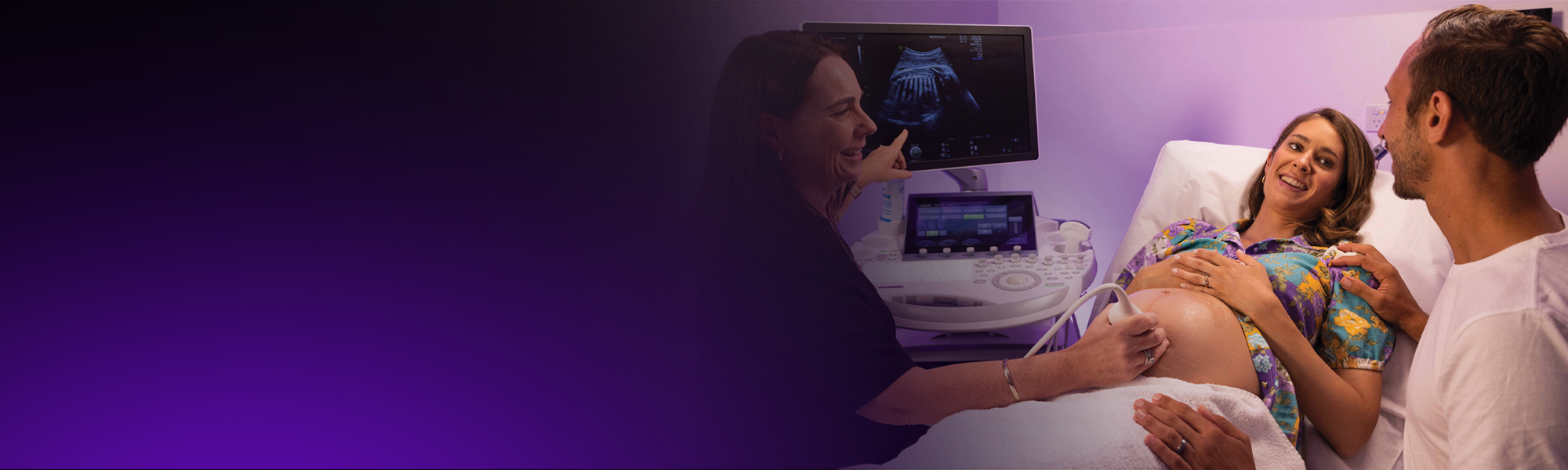 A female sonographer performs a pregnancy ultrasound
